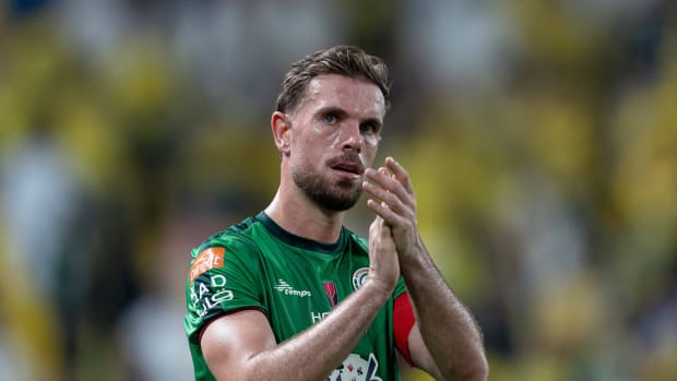 Jordan Henderson pictured applauding Al-Ettifaq fans after a game against Al Nassr in October 2023